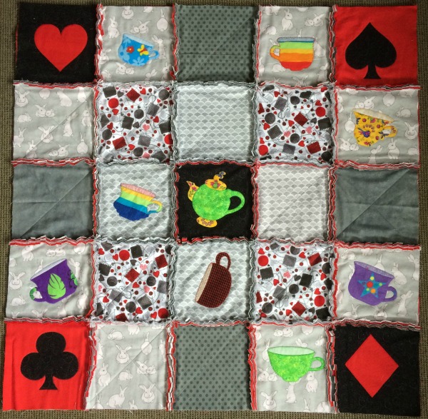 Applique rag quilt blocks stitched into rows